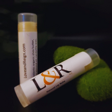 Load image into Gallery viewer, Healing properties for dry, cracked lips. Provides lasting lip moisture. Made with organic unrefined grade A shea butter, sweet almond oil, candelilla wax, calendula oil, and vitamin E. Unscented, naturally pigmented by ingredients. Vegan lip care.
