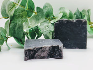 Our soap designs and fragrances are made with natural colorants and pure essential oils. Naturally pigmented with Organic Activated Charcoal. Scented with an invigorating blend of tea tree, rosemary, peppermint, and lavender essential oils.  Great facial bar and good for ally skin types.  Aides in acne, blemish, pore size reduction.  Draws out impurities.  Cruelty free. 