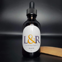 Load image into Gallery viewer, L&amp;R Beard oil (2oz)  cares for your beard and underlying skin. Helps the manageability of your beard and adds moisture naturally.  Made with jojoba oil, sweet almond oil, and an refreshing essential oil blend .  Great for all skin and hair types. Choose from our 4 premium essential oil blends (unscented available). Best used with wooden beard comb.
