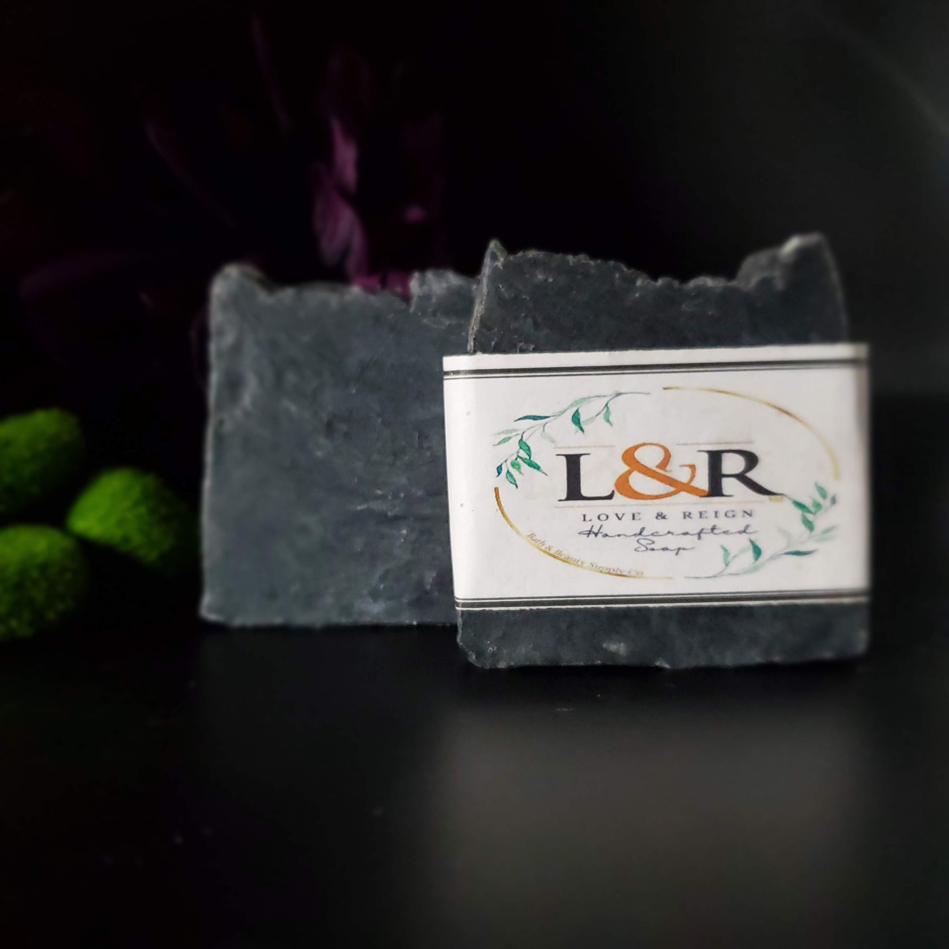 Our soap designs and fragrances are made with natural colorants and pure essential oils. Naturally pigmented with Organic Activated Charcoal. Scented with an invigorating blend of tea tree, rosemary, peppermint, and lavender essential oils.  Great facial bar and good for ally skin types.  Aides in acne, blemish, pore size reduction.  Draws out impurities.  Cruelty free. 