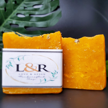 Load image into Gallery viewer, Handcrafted with all natural ingredients (saponified shea butter, coconut oil ,olive oil, castor oil, and sweet almond oil) free from harsh chemicals. Formulated using a plant based recipe, designed to cleanse your cleanse your hair and provide moisturization. Our soap designs and fragrances are made with natural colorants and pure essential oils. Naturally pigmented with  annatto seed powder. Scented with tea tree oil essential oil.
