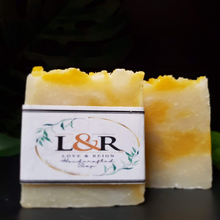 Load image into Gallery viewer, Formulated using a plant based recipe, designed to cleanse your skin and provide moisturization. Our soap designs and fragrances are made with natural colorants and pure essential oils. Naturally pigmented with annatto seed powder.  Scented with lavender &amp; patchouli essential oils.  Calming scent profile. 
